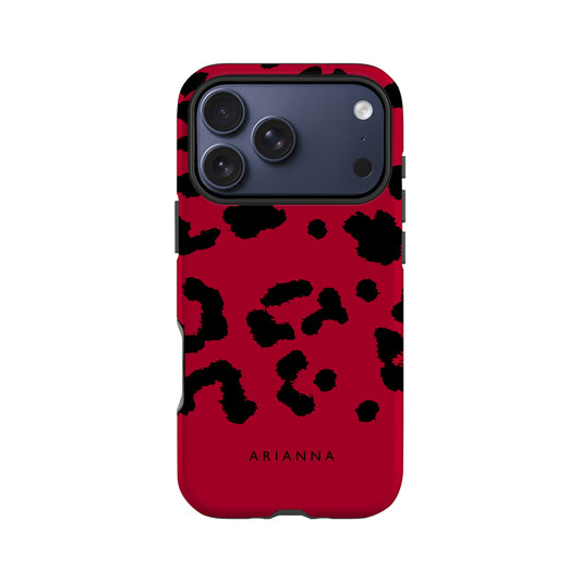 A red phone case with a leopard print pattern and the name "ARIANNA" printed on it.