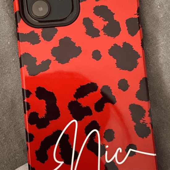 Red leopard print phone case with the name Nic personalised in a white cursive font