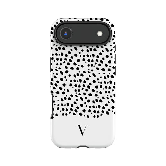 a phone case with a black and white polka dot pattern and a camera lens on the top.